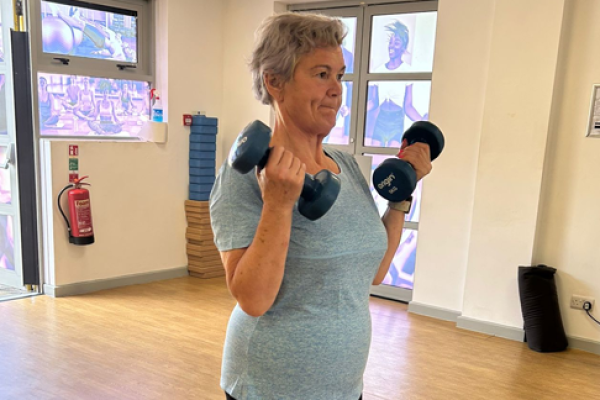 Carolyn Harris MP lifting two dumbbells