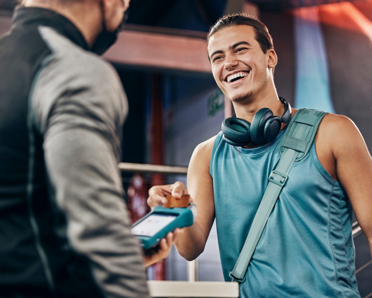 Men, credit card machine or payment in gym membership, personal trainer access or fitness coaching subscription. Banking device, nfc or cashless transaction or happy, smile or training sports athlete