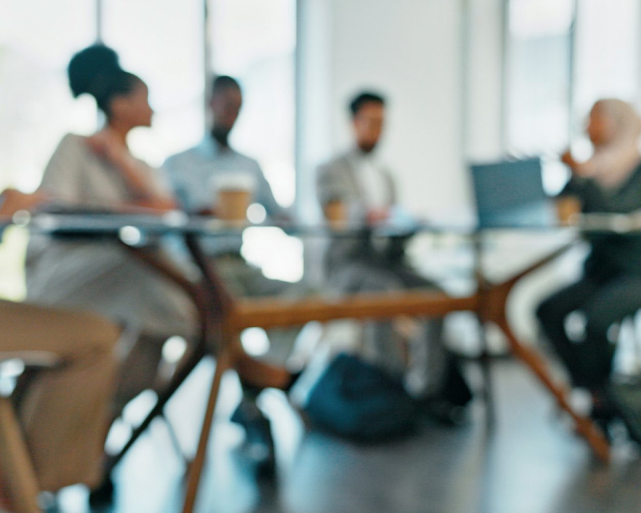 Blur, corporate meeting and staff brainstorming in office boardroom, speaking and share ideas. Planning, team and employees working on strategy, confirm client budget and collaboration in workplace