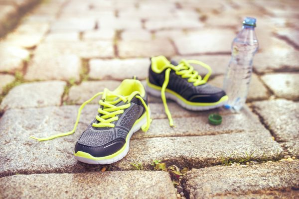 Running shoes and bottle of water