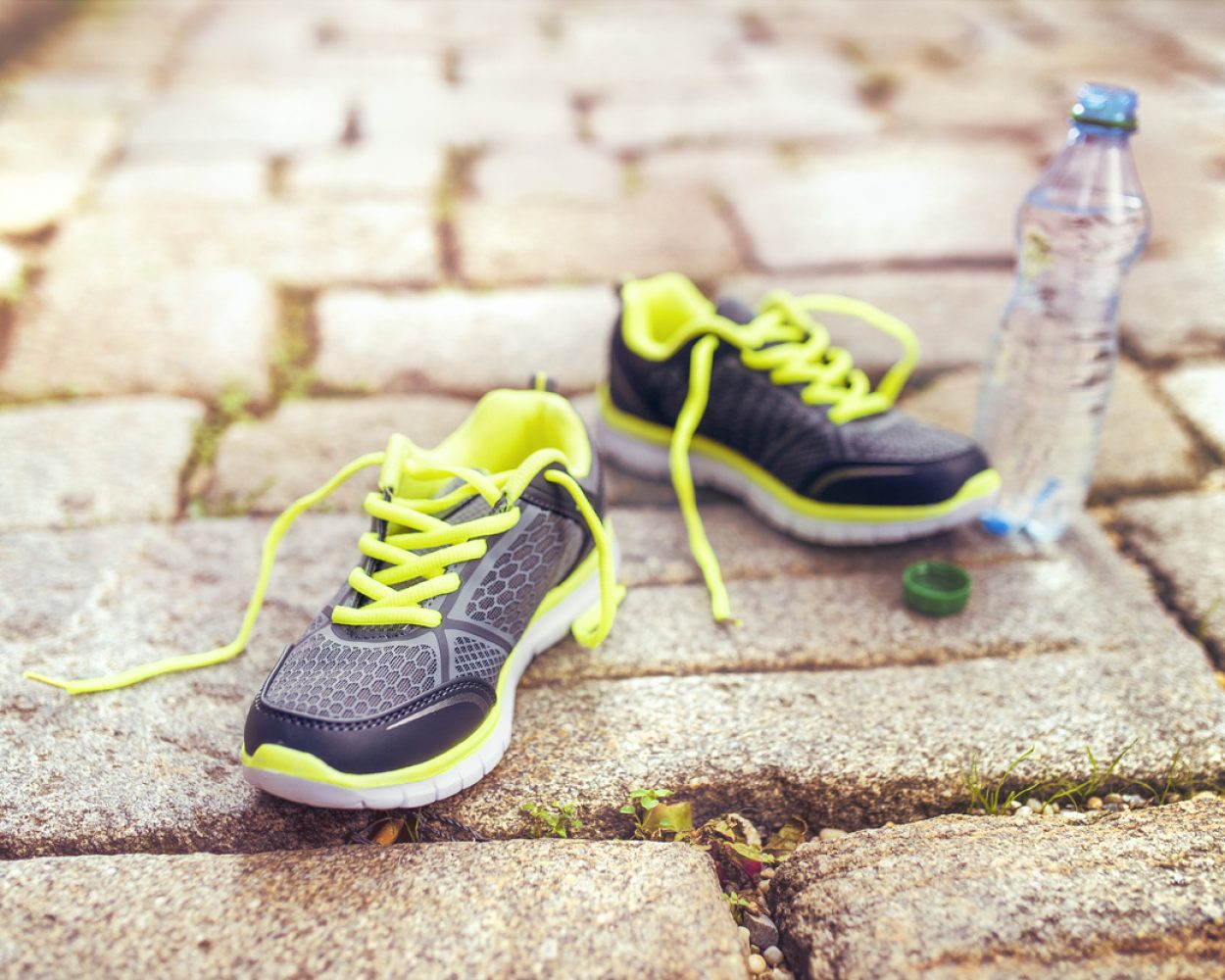 Running shoes and bottle of water