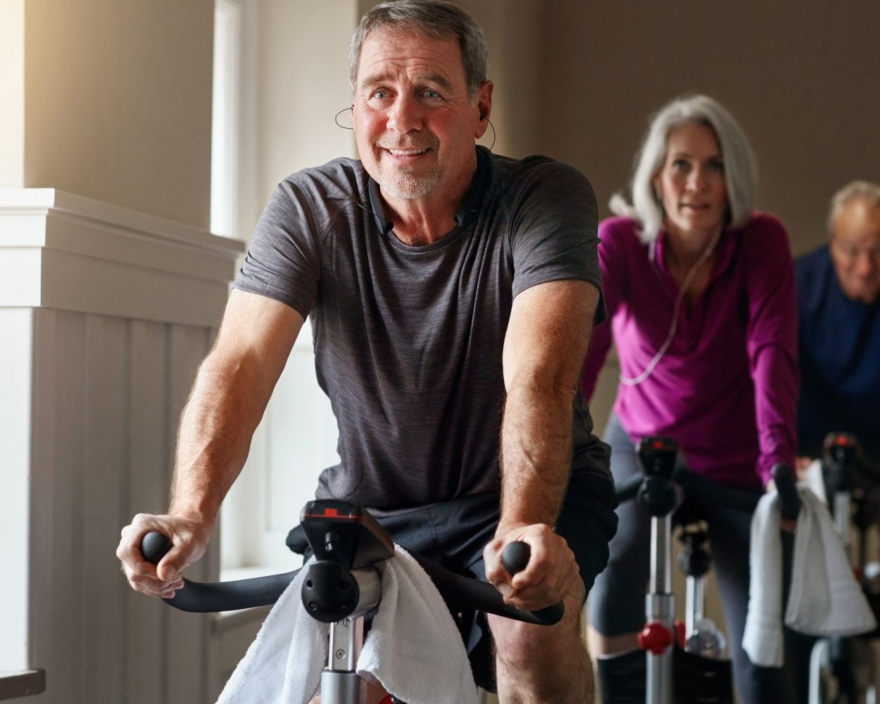 Shot of a group of seniors having a exercising class at the gym