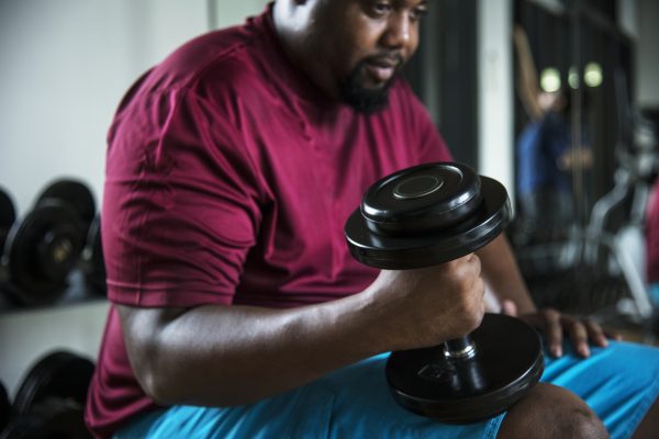 Man lifting weights at the gym